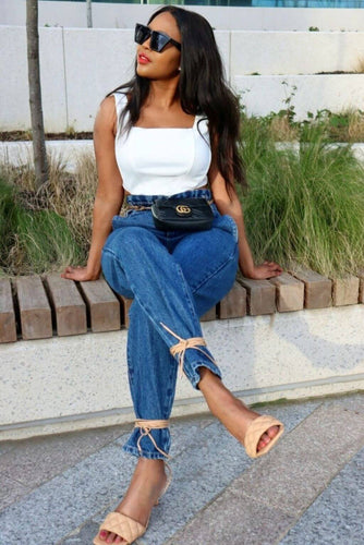 Model flaunting her curves in the stylish White Corset Top paired with figure-flattering shape denim.
